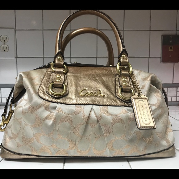 Coach Handbags - Coach champagne & bronze signature pattern purse